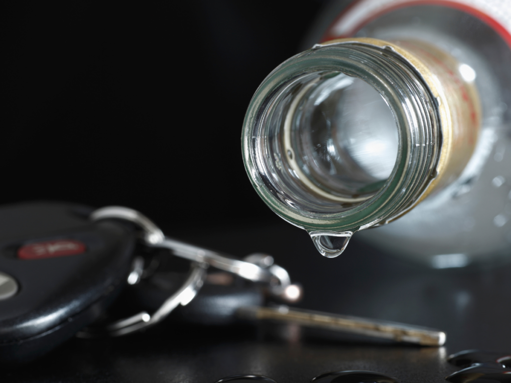 Liquor dripping onto car keys.